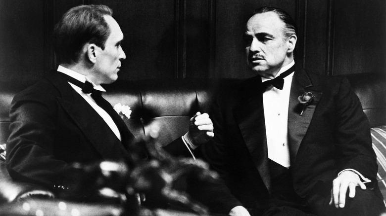 Marlon Brando sitting in Godfather