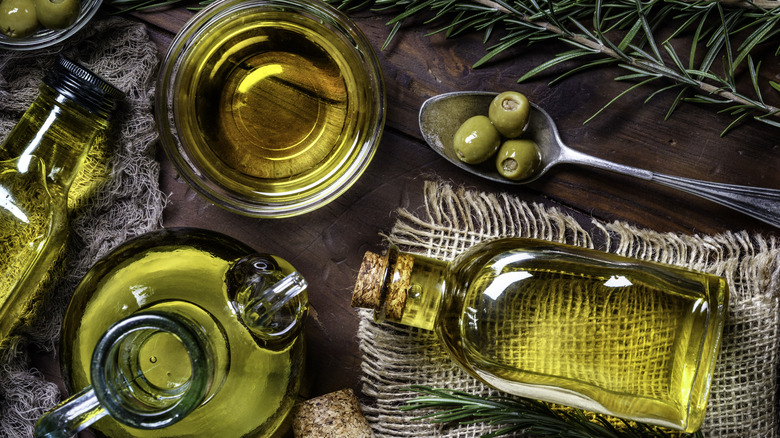 containers of olive oil on table