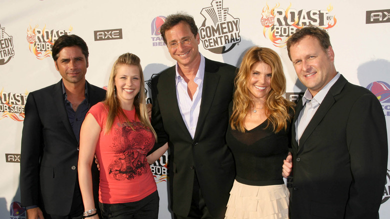 Bob Saget posing with Full House co-stars