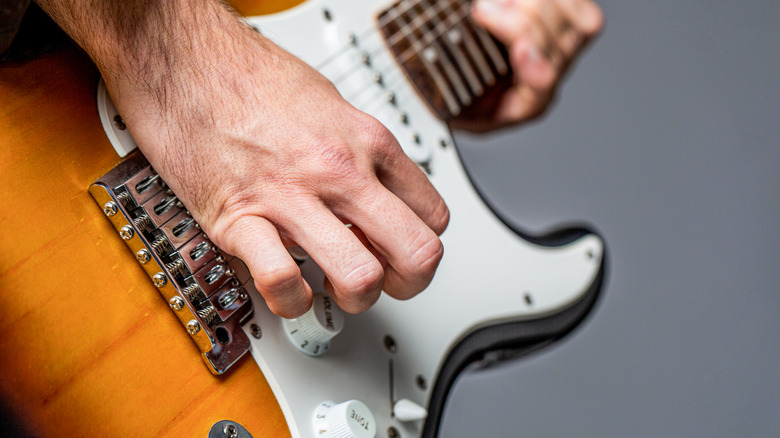 man playing guitar