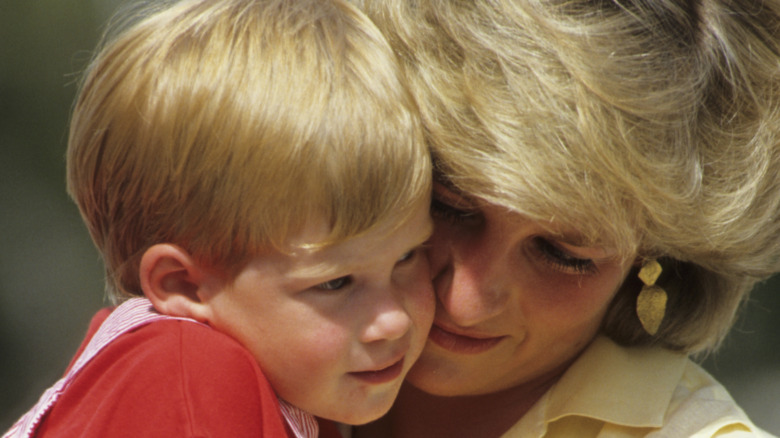 Princess Diana holds Prince Harry