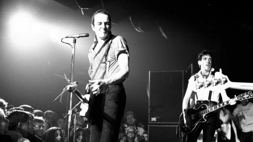 Joe Strummer and Mick Jones playing live