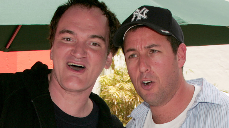 Adam Sandler and Quentin Tarantino heads close mouths open