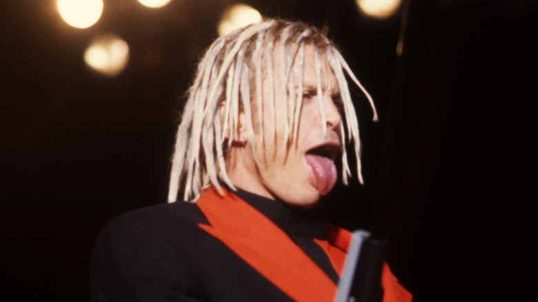 billy idol sticks tongue out and wears dreadlocks during cyberpunk concert