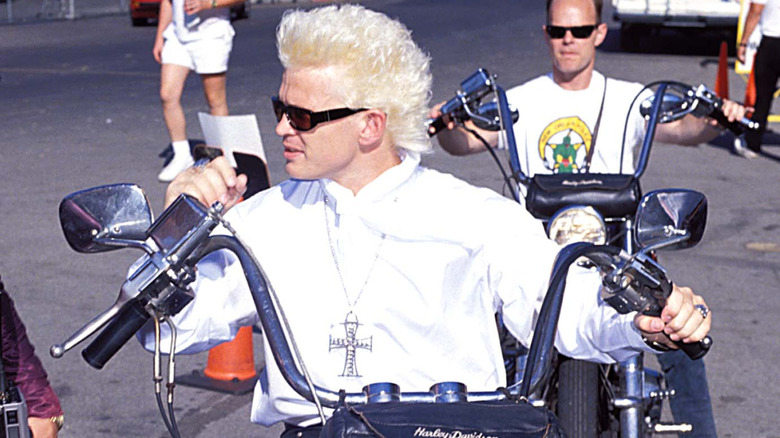 billy idol wearing sunglasses and riding motorcycle