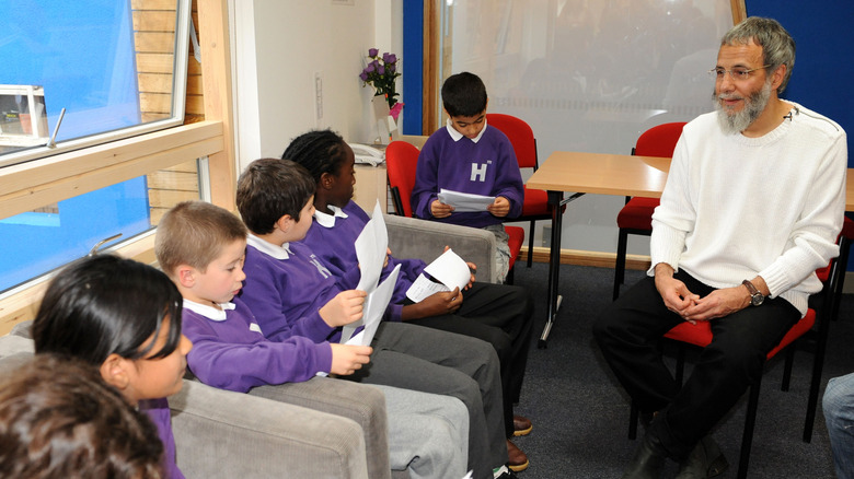 Cat Stevens sat speaking with schoolchildren