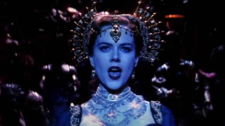 Nicole Kidman in costume singing in scene from Moulin Rouge!