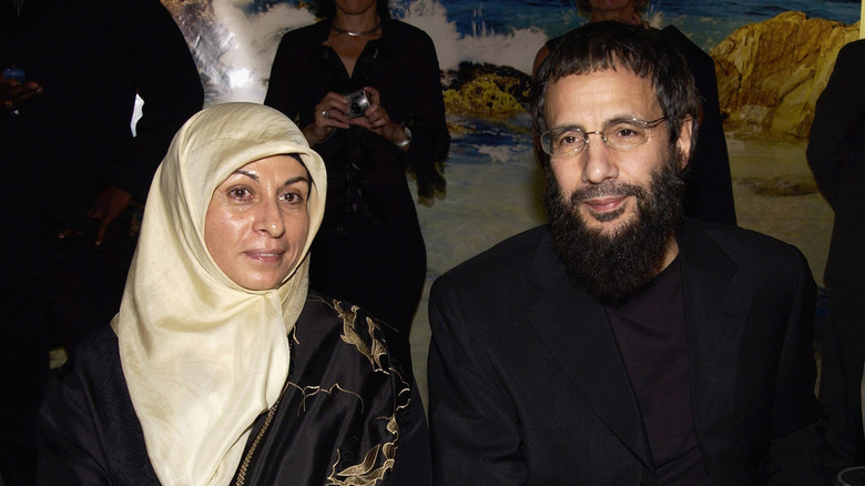 Cat Stevens with his wife, Fawzia, in smart dress at event