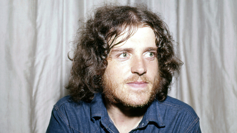 Joe Cocker in blue shirt looking away