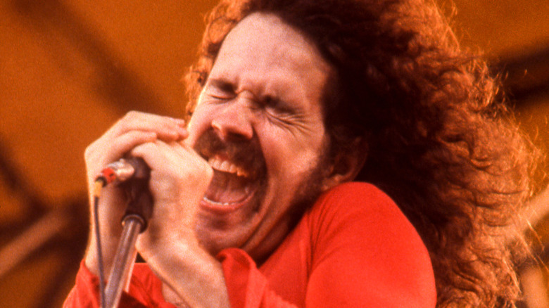 brad delp of boston singing hard onstage in the 1970s