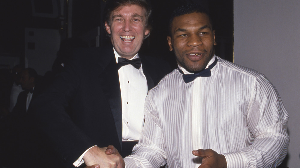 Donald Trump and Mike Tyson smiling 