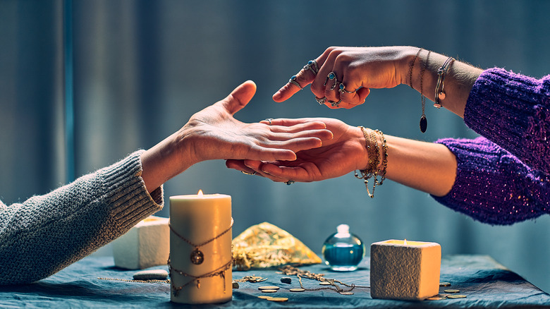 palm reading, with candles