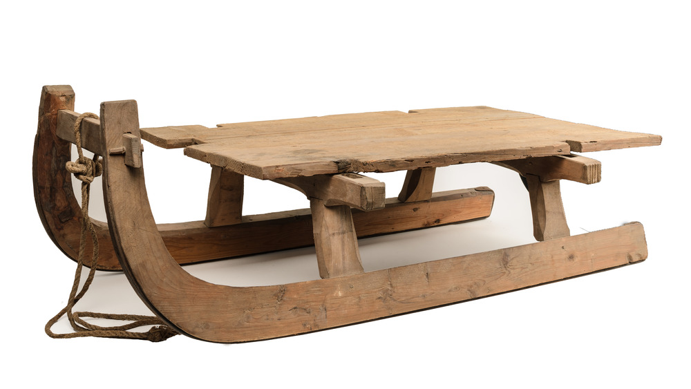 A photograph of a very old sled.