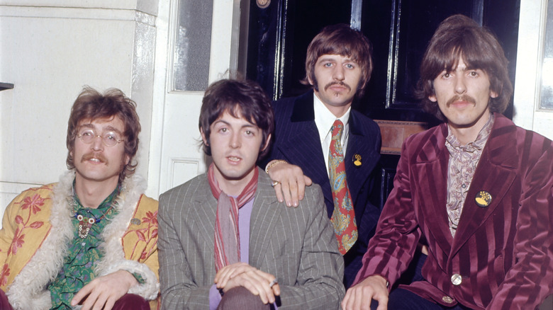 The Beatles posing for photo