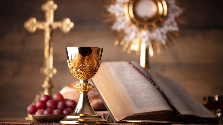 Chalice, crucifix, sacrament