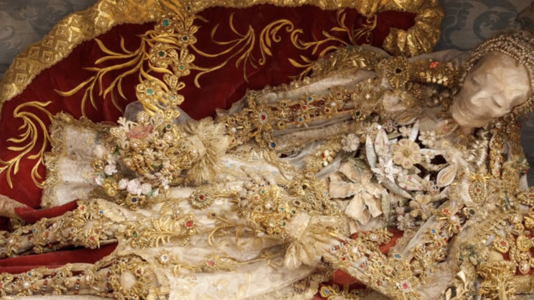 skeleton covered in jewels and precious metals