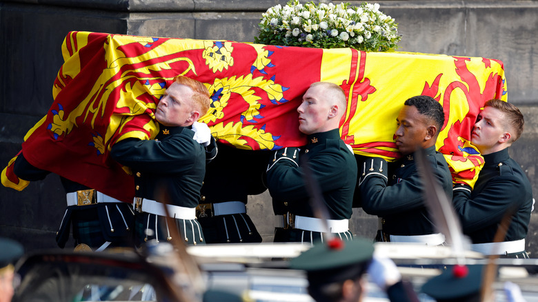 Queen's coffin being carried  