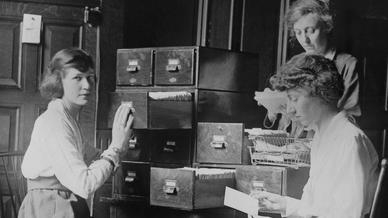 Women filing office documents