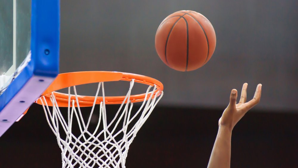 Basketball flying into the hoop