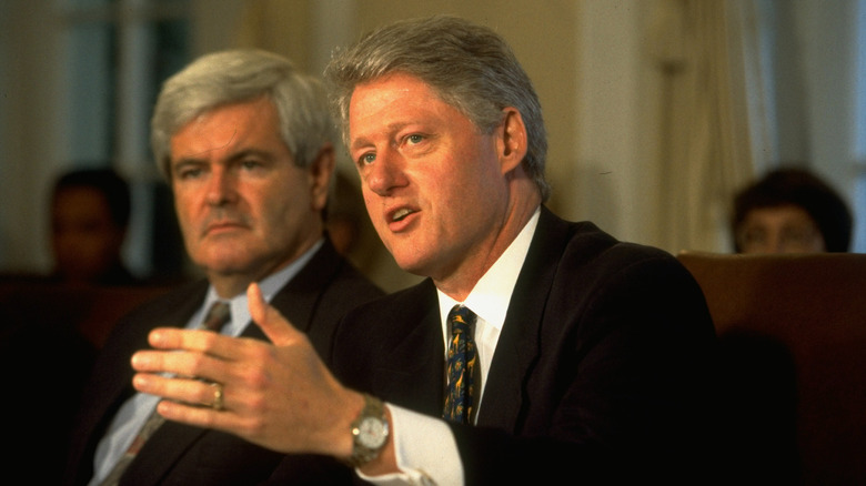 Bill Clinton talking next to Newt Gingrich