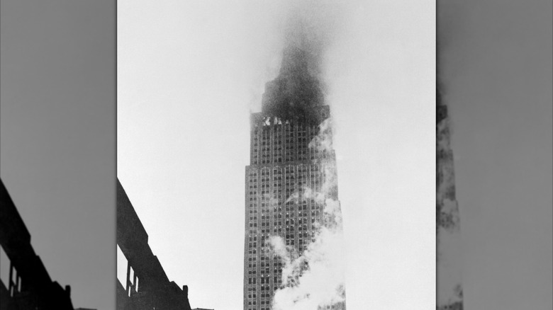 Empire State Building in flames with black smoke after plane crash