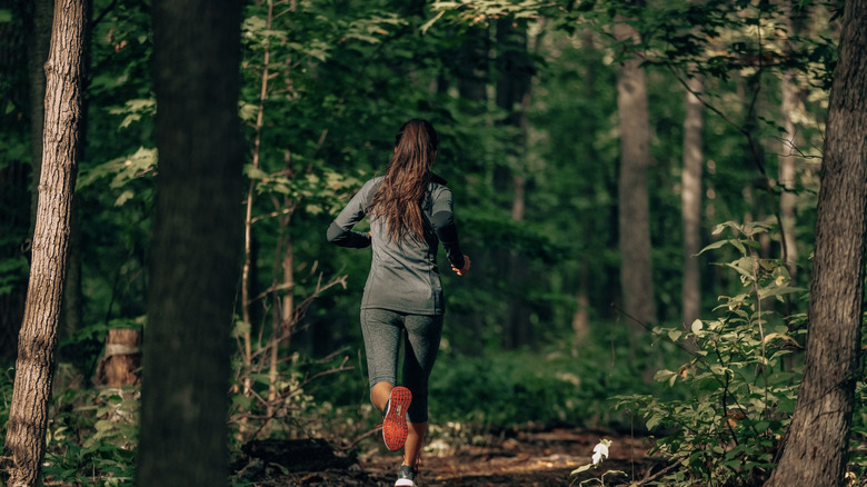 woman running in the forest