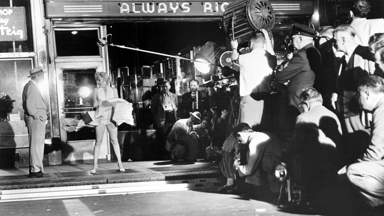Marilyn Monroe and Tom Ewell filming the famous "flying skirt" scene, NYC, 1954