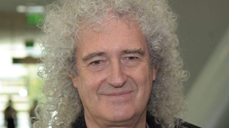 Brian May smiling