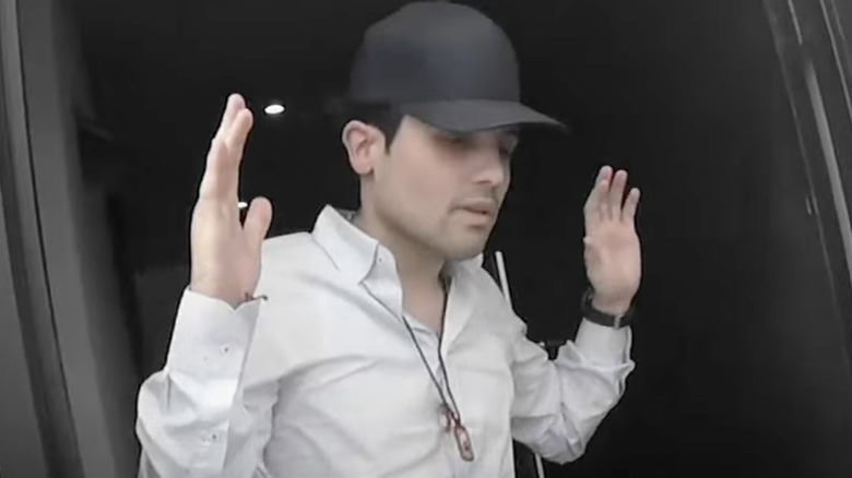 Ovidio Guzman Lopez hands up getting arrested