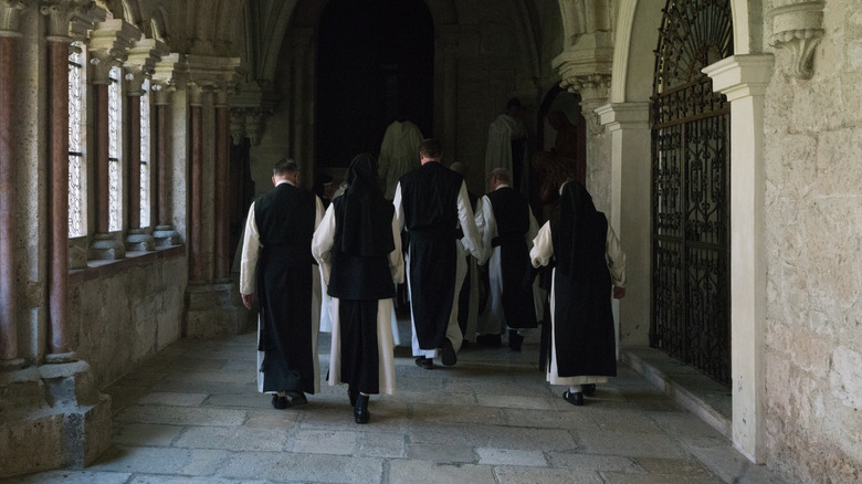 Cistercian monks walking in monastery