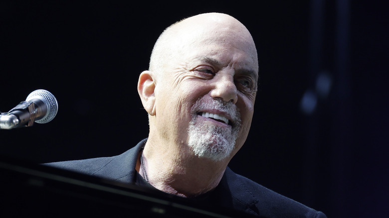 Billy Joel smiling looking to side