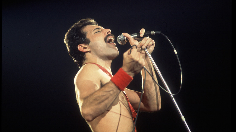 Freddie Mercury shirtless with microphone