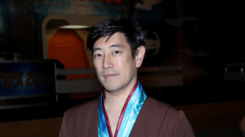 Grant Imahara at convention in Star Trek-inspired outfit