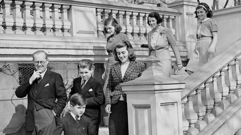 Joseph P. Kennedy Sr. with his kinds on a stairway