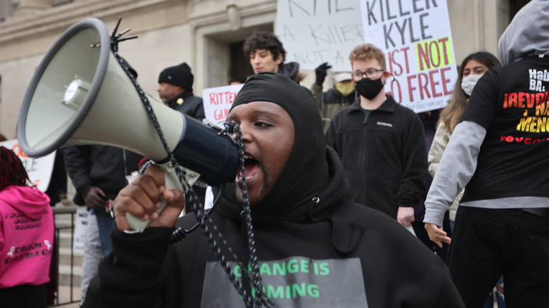 Protesters gather outside the courthouse