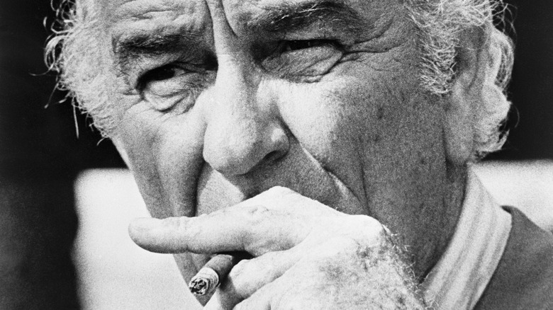 Lyndon Johnson smokes a cigarette