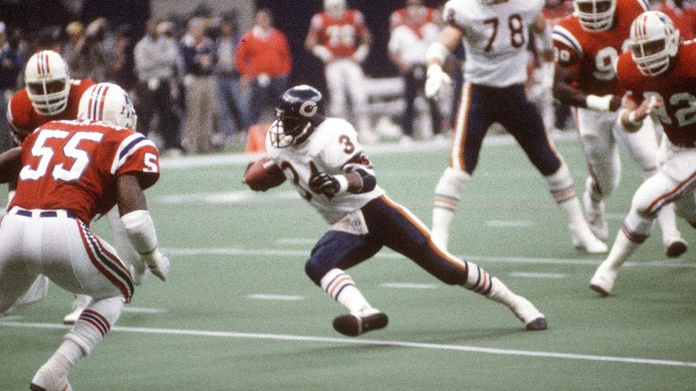 Walter Payton running with football