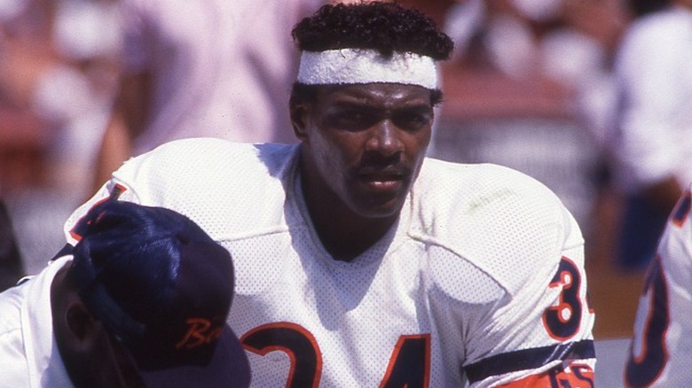 Walter Payton sitting on sidelines