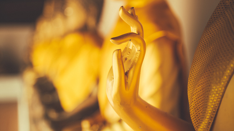gold buddha hand