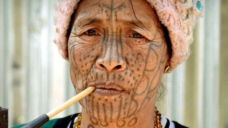 Spider Woman smokes