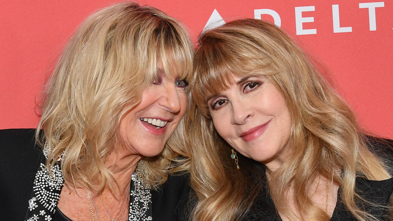 Christine McVie posing with Stevie Nicks