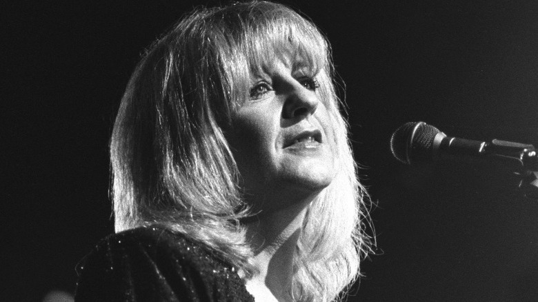 Christine McVie singing into microphone