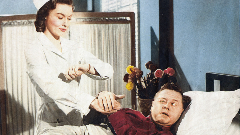 Mickey Rooney in a hospital bed movie scene