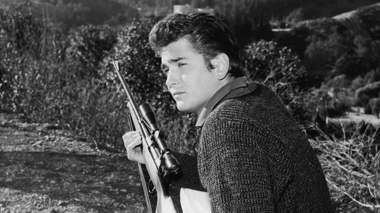 Michael Landon holding gun