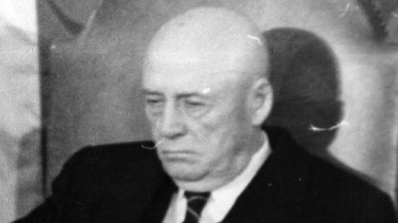 Sam Rayburn in chair looking down