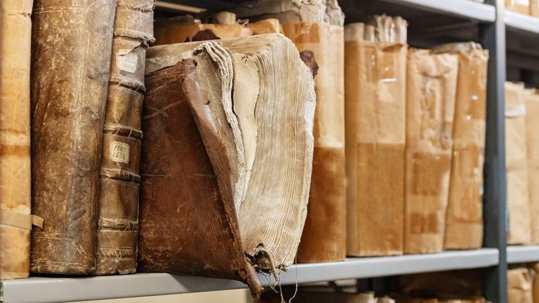 Old leather bound books on shelf