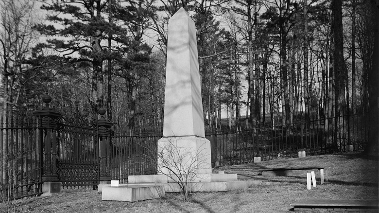 Thomas Jefferson's grave stands before woods