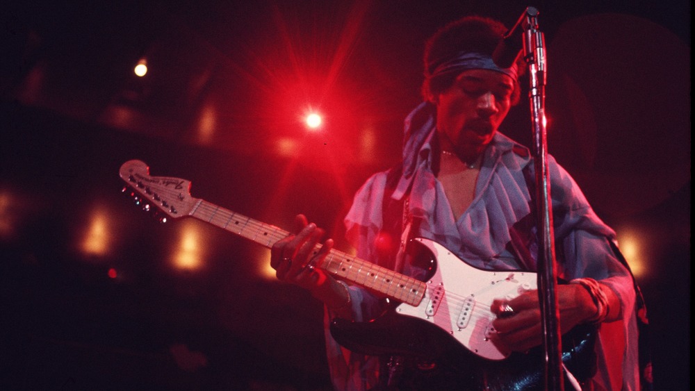 Jimi Hendrix plays