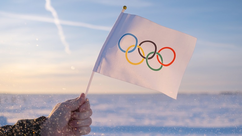 hand holding olympic flag