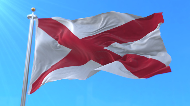 Alabama State Flag flying against blue sky